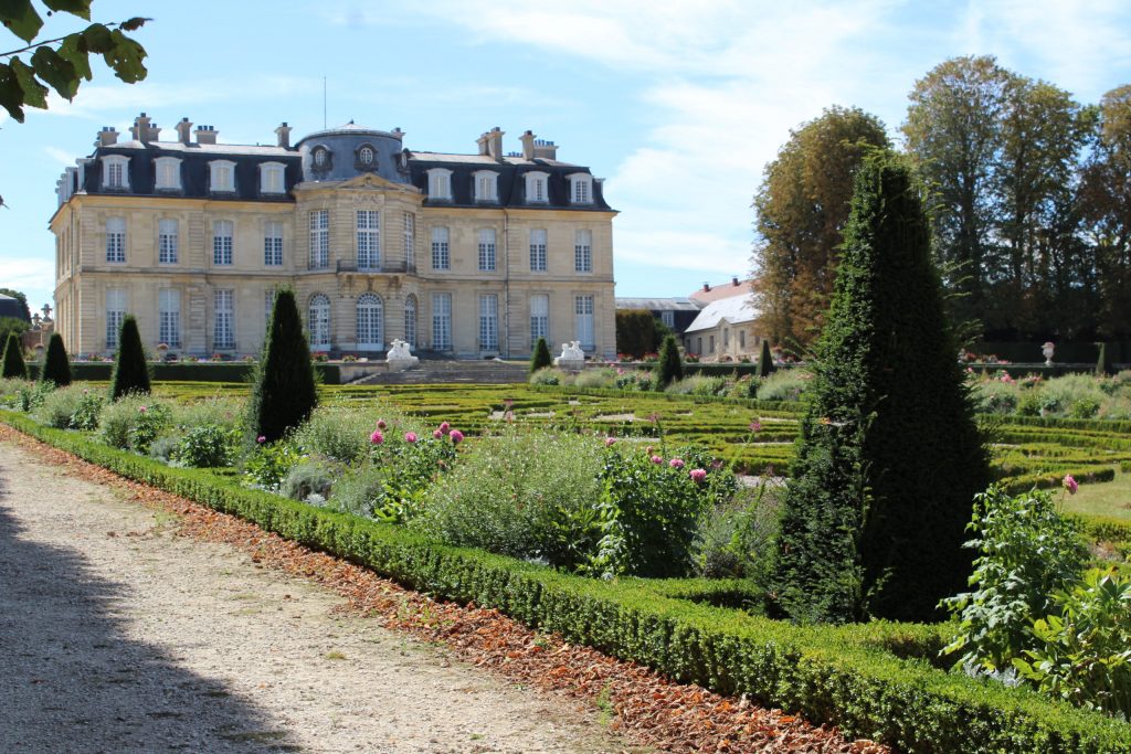 A photo looking back up at the chateau from the gardens at the Château de Champs-sur-Marne.